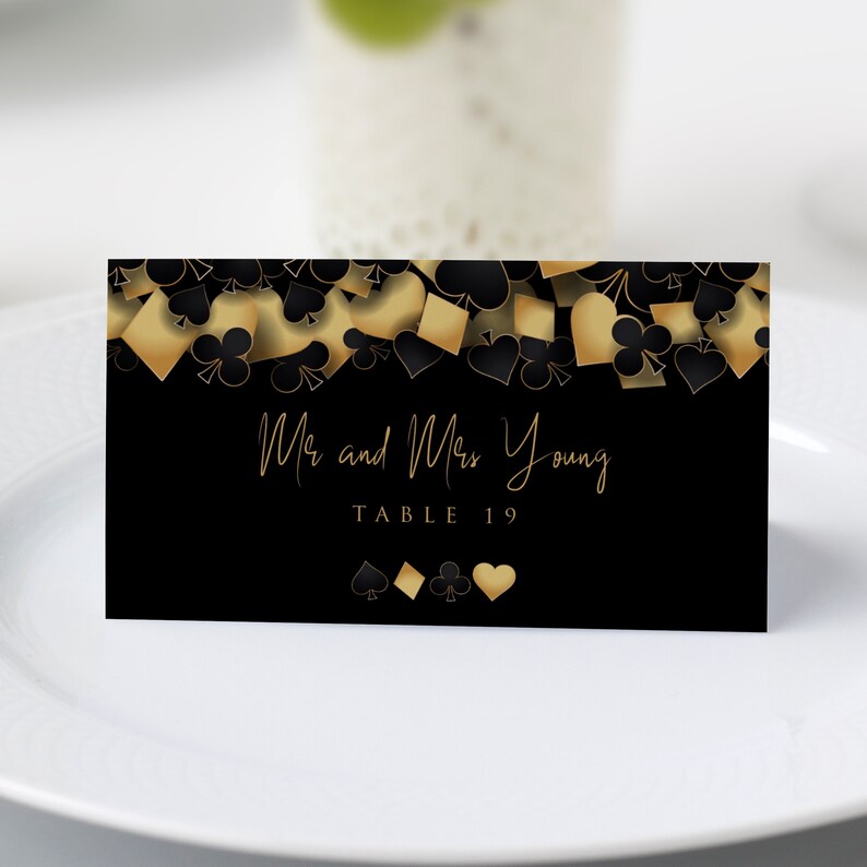These fun casino night escor cards are designed with a black background with hearts, spades, diamonds, and clubs upper frame. Designed By MetroEvents