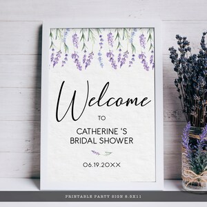 May include: Printable welcome sign for a bridal shower with a lavender floral design. The sign says "Welcome to Catherine's Bridal Shower 06.19.20XX".