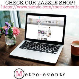 May include: A silver laptop displaying the Metro-events website on its screen. The screen shows a banner with the text Metro-events and a grid of product thumbnails. A glass jar with flowers and a pink mug sit on the wooden surface nearby.