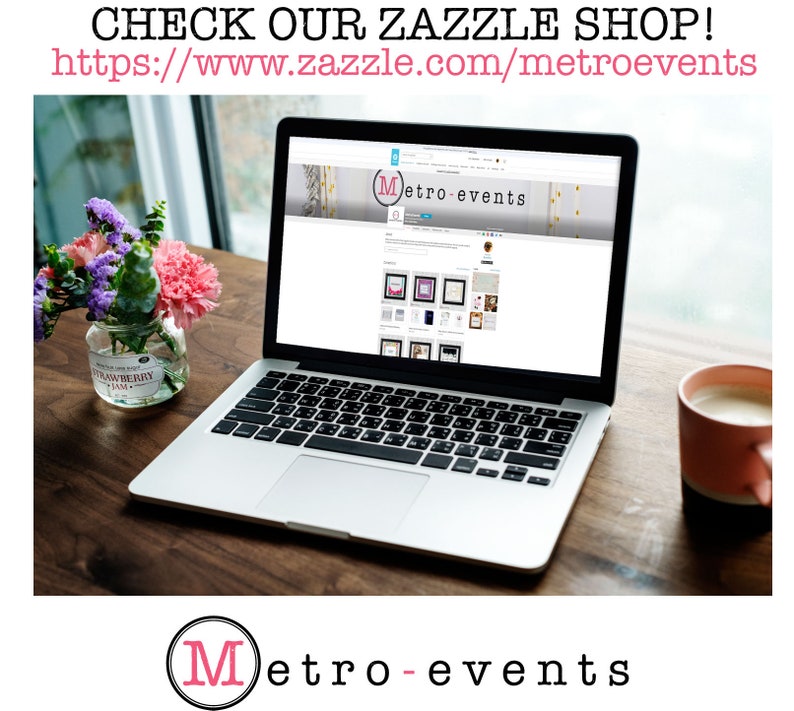 May include: A silver laptop displaying the Metro-events website on its screen. The screen shows a banner with the text Metro-events and a grid of product thumbnails. A glass jar with flowers and a pink mug sit on the wooden surface nearby.