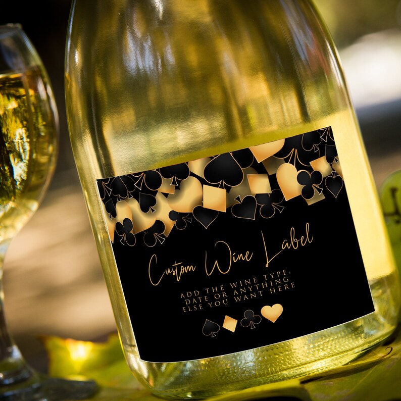 These fun casino night wine labels are designed with a black background with hearts, spades, diamonds, and clubs upper frame. Designed By MetroEvents
