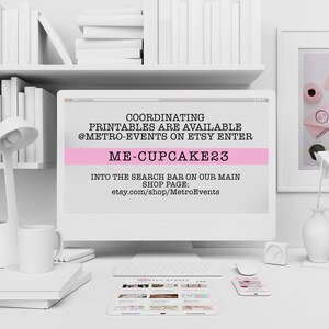 May include: A desktop computer screen displays text: "COORDINATING PRINTABLES ARE AVAILABLE @METRO-EVENTS ON ETSY ENTER ME-CUPCAKE23 INTO THE SEARCH BAR ON OUR MAIN SHOP PAGE: etsy.com/shop/MetroEvents." The computer is on a white desk with a keyboard, mouse, tablet, and phone.