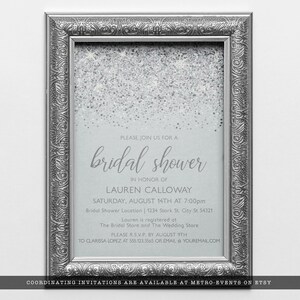 Sparkling Silver Glitter Invitations. A glam style invite created with faux silver glitter on a coordinating silver background with elegant text. Designed By MetroEvents.