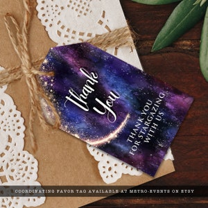 Night under the stars, galaxy-themed favor tag. This design is created with a star-filled purple and blue starry sky background with a half-ring of shooting stars training through it. Designed by MetroEvents.