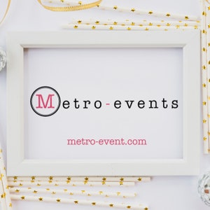 May include: A white rectangular picture frame containing a white sign with the black text Metro-events and the pink text metro-event.com. The letter M is inside a black circle. The frame is surrounded by white paper straws with gold stars.