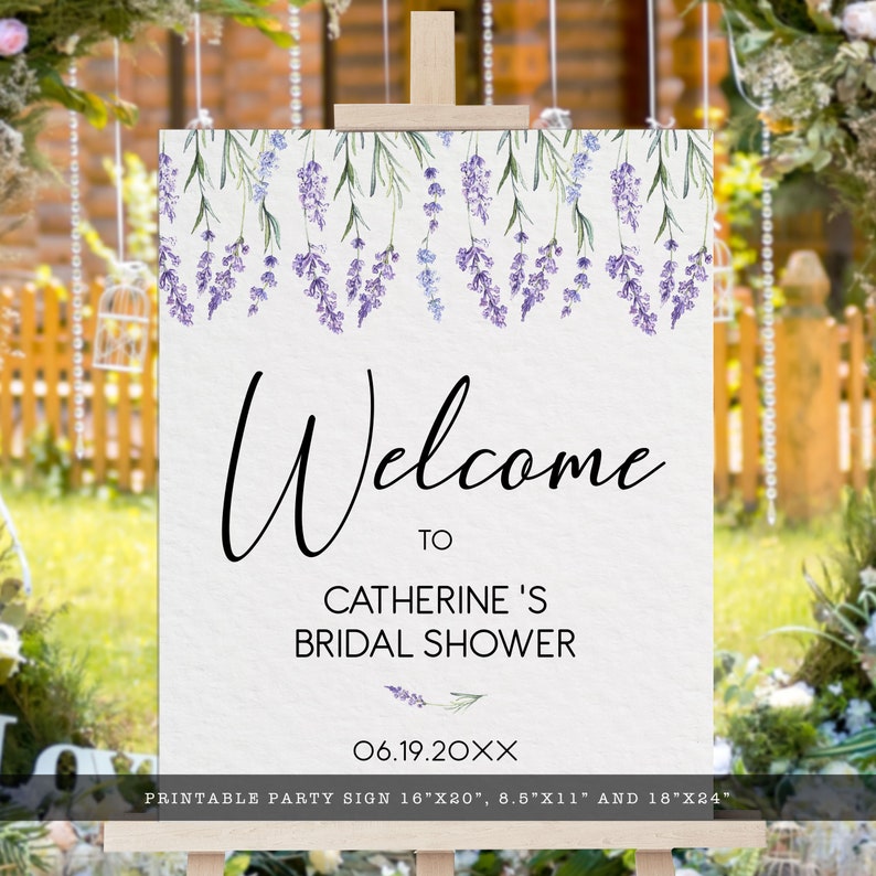 May include: Printable welcome sign for a bridal shower with a lavender floral design. The sign says "Welcome to Catherine's Bridal Shower 06.19.20XX". The sign is available in three sizes: 16"x20", 8.5"x11", and 18"x24".