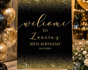 May include: A black and gold welcome sign on a wooden easel. The sign reads "welcome to Lauren's 30th Birthday" in gold script. The top and bottom of the sign are decorated with gold glitter. Balloons and flowers are in the background.