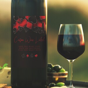 Roll the dice, throw down your royal flush it's casino night! Fun and elegant adult party wine labels are designed with a black background with hearts, spades, diamonds, and clubs' upper frame. Designed by MetroEvents