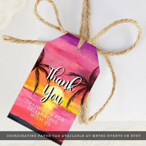 May include: A colorful gift tag with a sunset design, featuring palm trees and the words "Thank You." The tag is tied with twine. The text "Thank You For Celebrating With Us" is also visible.