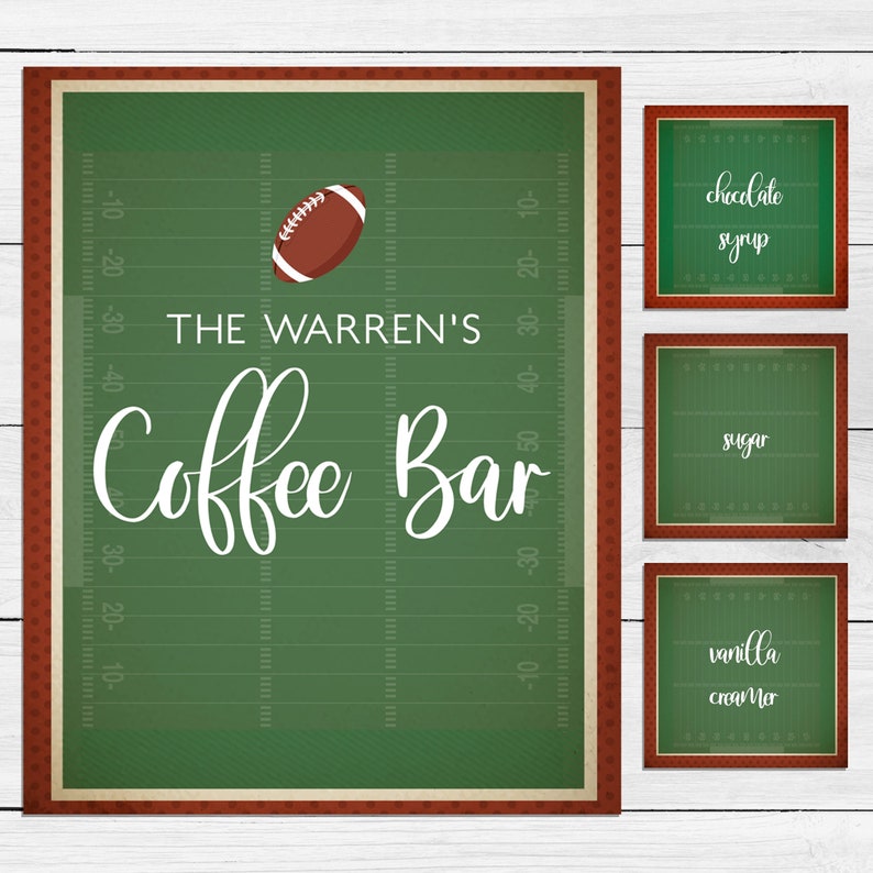 May include: A set of four rectangular signs featuring a green football field design with yard line markings and a brown football. The large sign reads THE WARREN'S Coffee Bar, while the three smaller signs read chocolate syrup, sugar, and vanilla creamer.