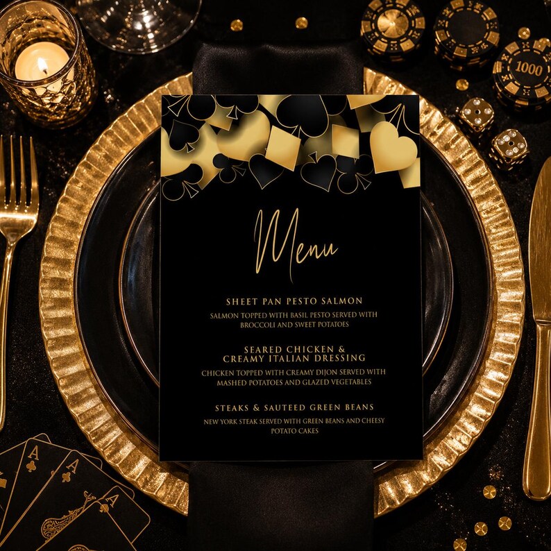 May include: A black menu card with gold text and a top border featuring gold and black playing card suit symbols. The text reads Menu, Sheet Pan Pesto Salmon, Seared Chicken & Creamy Italian Dressing, and Steaks & Sauteed Green Beans.
