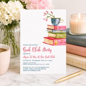 May include: A white rectangular invitation card featuring a watercolor illustration of a blue teacup with pink flowers resting on a stack of three colorful books. The text reads: Please join us for a Book Club Party hosted by Agree To Diss A Brie Book Club.