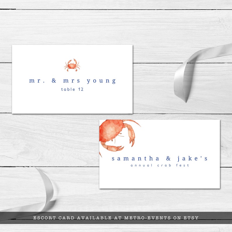 Crab Boil, Seafood Festival Escort Card. Featuring an orange watercolor crab with a blue striped back with a watercolor texture. Designed by MetroEvents.