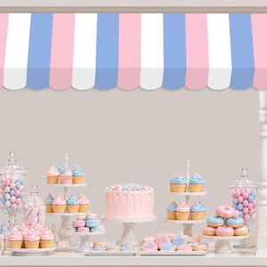 May include: A dessert display stand featuring a scalloped awning with vertical stripes in pink, white, and light blue. The stand holds a variety of sweets including a frosted cake, cupcakes, donuts, candies in glass jars, and cookies on white pedestals.
