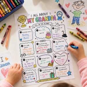 May include: A fill-in-the-blanks poster titled "All About My Grandpa" with colorful illustrations and prompts. Includes space for writing about grandpa's name, age, job, favorite things, and why he is loved. Crayons and a drawing are in the background.