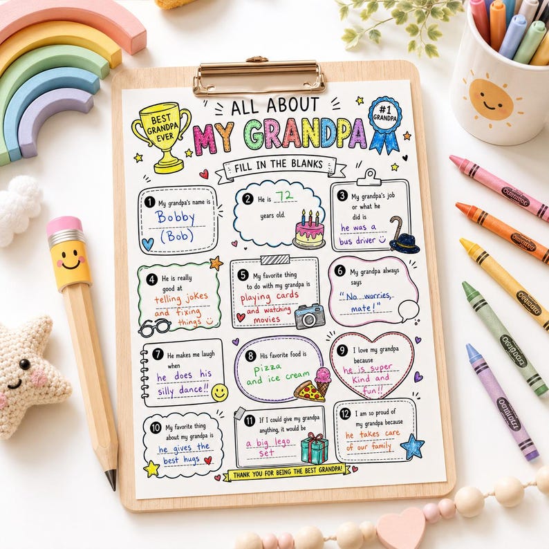May include: A colorful "All About My Grandpa" fill-in-the-blanks sheet on a wooden clipboard. The sheet includes prompts about his name, age, job, favorite things, and a space for a drawing. A pencil, crayons, and wooden toys are nearby.