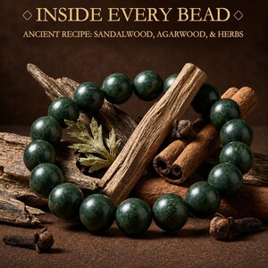 May include: A circular bracelet of dark green, polished beads arranged around pieces of wood, cinnamon sticks, and dried cloves. The text reads: INSIDE EVERY BEAD, ANCIENT RECIPE: SANDALWOOD, AGARWOOD, & HERBS. The composition features natural textures.