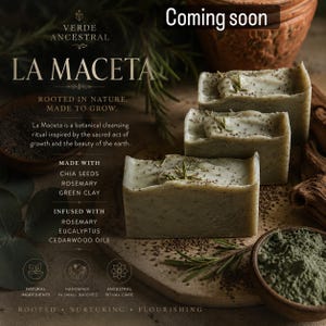 May include: Three rectangular bars of handmade soap, speckled with seeds and herbs, are displayed on a wooden surface. The soap is light green, with sprigs of rosemary. The image includes text that says "La Maceta" and "Coming soon."