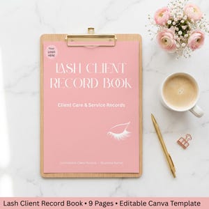 May include: A pink clipboard with the text "LASH CLIENT RECORD BOOK" and "Client Care & Service Records". A gold pen, a cup of coffee, and a small bouquet of pink flowers are also on the white marble surface.