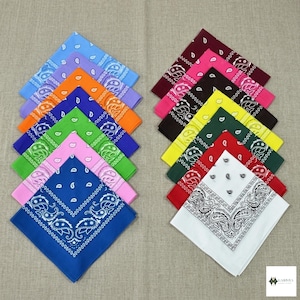 May include: A collection of bandanas in various colors, including blue, purple, orange, green, pink, red, white, yellow, and black. Each bandana features a paisley design.