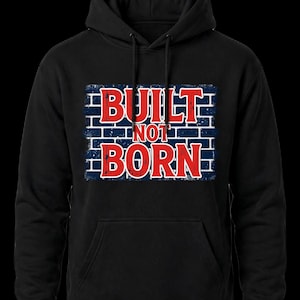 May include: A black hooded sweatshirt featuring a graphic on the chest. The graphic displays the text "BUILT NOT BORN" in bold red letters against a dark blue brick wall background with a distressed, weathered texture.