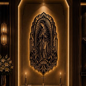 May include: A black metal wall art piece depicting the Virgin of Guadalupe with an intricate art deco frame, backlit by warm light. It is centered above a dark altar featuring a gold cross, two lit candles, and a central cross emblem.