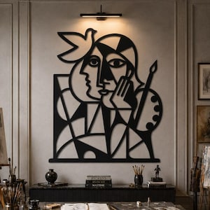 May include: A large black metal wall art piece featuring a stylized cubist portrait of a person with a bird perched above their head, a paintbrush, and a painter's palette, all rendered in bold, geometric lines and solid black shapes.