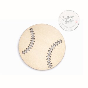 May include: A wooden baseball cutout with stitched detailing. The baseball is light brown with white stitching. A circular logo with the text "Southern Hauth Designs" is in the upper right corner.