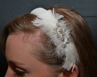 White bridal headband with feathers and rhinestones