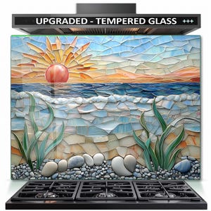 May include: A rectangular tempered glass kitchen backsplash featuring a mosaic-style print of a sunrise over the ocean. The design includes a red sun, blue waves, sandy beach, green sea grass, and grey pebbles. Text at the top reads UPGRADED - TEMPERED GLASS +++.