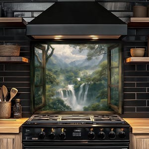 May include: A black range hood and stove with a framed window featuring a waterfall scene. The window is open, revealing a lush green landscape with a cascading waterfall and distant mountains. The kitchen has black tile and wooden shelves.