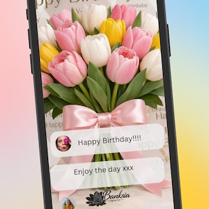May include: A smartphone displaying a digital birthday greeting card featuring a bouquet of pink, white, and yellow tulips tied with a pink ribbon. The screen shows the text Happy Birthday, Happy Birthday!!!!, and Enjoy the day xxx, with a Banksia Digital Co logo.