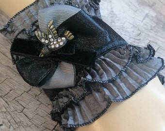 Grey ruffle single cuff, upcycled fabric bracelet adorned with bow and bird charm