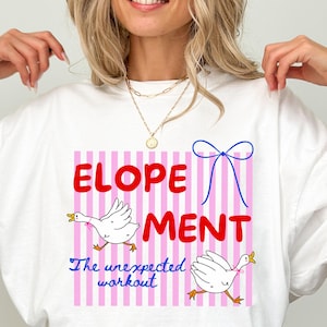 May include: White t-shirt with the word "ELOPEMENT" in red, a blue bow, and two cartoon geese. The text "The unexpected workout" is below the word "ELOPEMENT". The shirt has a pink and white striped background.