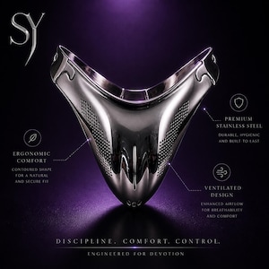May include: A polished, silver-colored metal face mask with a contoured shape and a ventilated design. The mask is made of premium stainless steel and is engineered for comfort and breathability. The text on the image reads: "Discipline. Comfort. Control."