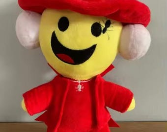 Lindo peluche de dibujos animados con sombrero rojo, muñeco de peluche divertido con carita sonriente, peluche suave y kawaii, regalo coleccionable para gamers y niños.