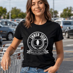 May include: A black short-sleeved t-shirt featuring a white graphic print of a Venn diagram inside a circular laurel wreath. The text reads INNER JOIN, BRINGING TABLES TOGETHER SINCE 1974, and Matched On A Common Key on a banner at the bottom.