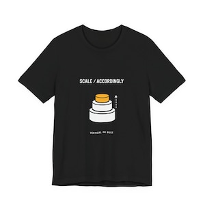 May include: Black t-shirt with the text "SCALE / ACCORDINGLY" above a graphic of a tiered structure with an upward arrow. The phrase "VERTICAL OR BUST" is printed below the graphic.