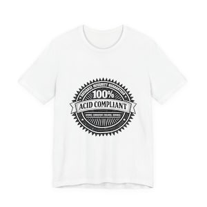 May include: White t-shirt with a black graphic. The graphic is a circular seal that reads "DATABASE INTEGRITY GUARANTEED" around the top, "100% ACID COMPLIANT" in the center, and "ATOMIC, CONSISTENT, ISOLATED, DURABLE" at the bottom.