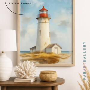 May include: A framed digital art print of a lighthouse. The lighthouse is white with a red top, set against a blue sky and ocean. The artwork is labeled "FAB ART GALLERY DIGITAL PRODUCT".