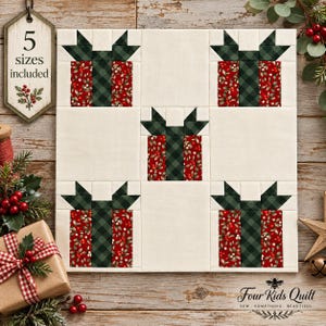 May include: A square quilt block pattern featuring five gift box designs arranged in a grid. Each gift box is made of red fabric with a holly berry print, accented by a dark green plaid ribbon and bow, set against a solid cream background.