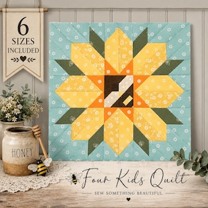 May include: A square quilt block featuring a central sunflower design in yellow, orange, and dark green on a light blue floral background. A hanging sign reads 6 SIZES INCLUDED. Text below reads Four Kids Quilt SEW SOMETHING BEAUTIFUL.