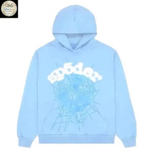 May include: Light blue hoodie with a hood and long sleeves. The front features the word "sp5der" in white, above a light blue spiderweb design. A casual, comfortable garment.