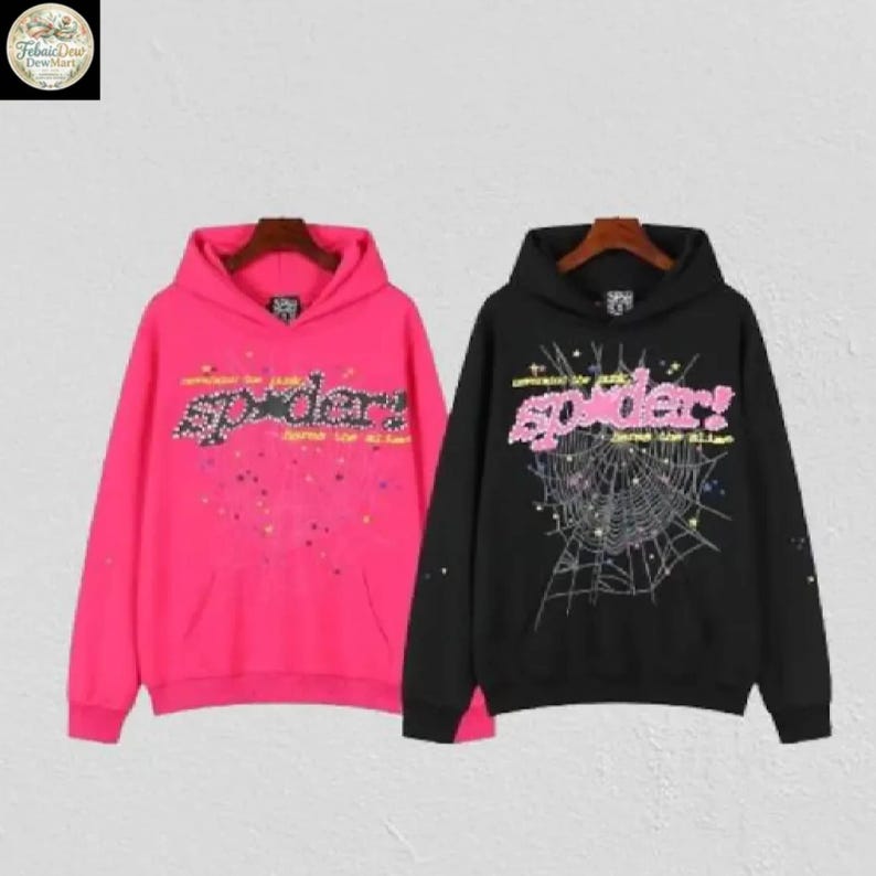 May include: Two hooded sweatshirts, one hot pink and one black, are displayed. Both feature the word "spider" in a stylized font across the chest. The pink sweatshirt has a splatter design, while the black one has a spiderweb graphic.