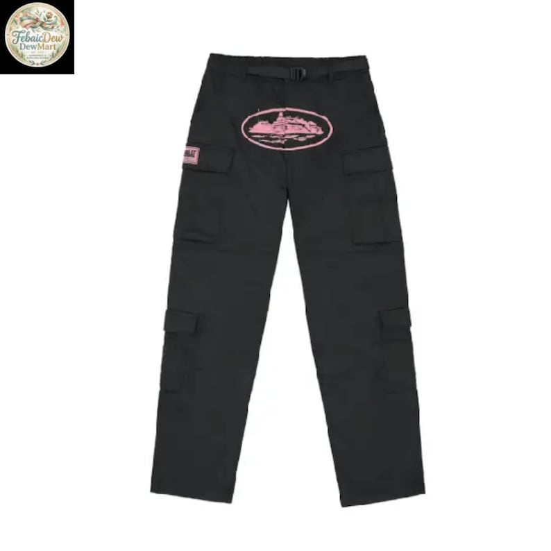 May include: Black cargo pants with multiple pockets and a belt. A pink oval graphic with a building design is centered on the front. A small pink square with text is on the left pocket.