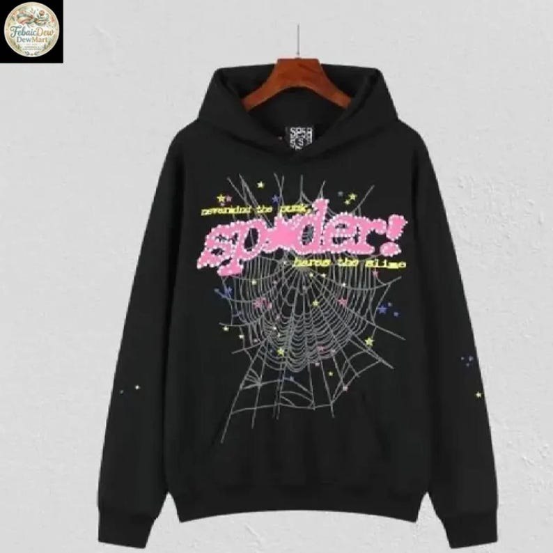 May include: Black hoodie with a graphic design featuring a spider web and the word "spider!" in pink, with the text "neverend the punk" above and "harms the slime" below. The design includes stars and other small details.