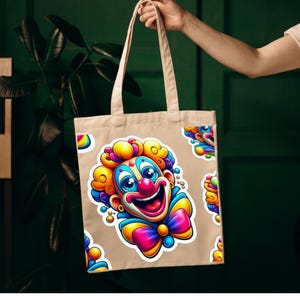 May include: A beige canvas tote bag featuring a repeating pattern of a colorful clown illustration. The clown has bright yellow, pink, and blue hair, a red nose, a wide smiling mouth, and a large, vibrant multi-colored bow tie at the neck.
