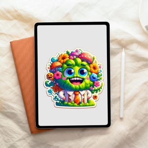 May include: A digital tablet displaying a colorful sticker of a green, furry creature with large blue eyes, a wide smile, and a beard. The creature is adorned with various flowers and mushrooms on its head and wears a white shirt with an orange tie.