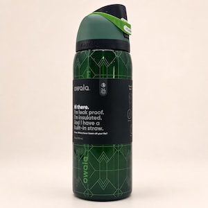 May include: A dark green Owala water bottle with a 32 oz capacity, featuring a black label with white text that reads: Hi there. I'm leak proof. I'm insulated. And I have a built-in straw. The bottle has a geometric line pattern and a black lid.