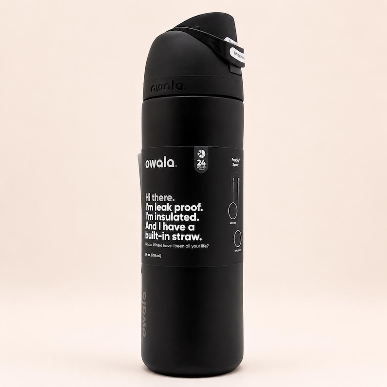 May include: A matte black Owala water bottle with a 24 oz capacity. The bottle features a black lid with a built-in straw and a black label with white text that reads: Hi there. I'm leak proof. I'm insulated. And I have a built-in straw.